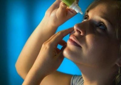 Woman-Putting-in-Eye-Drops 3 Woman Putting in Eye Drops 3